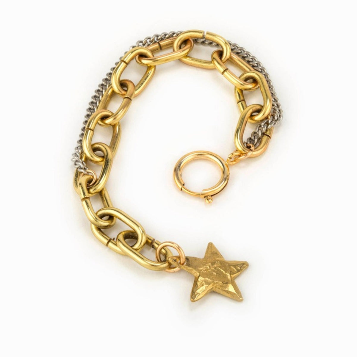 Gold and silver link bracelet coiled on white, with a round clasp ring and a hammered gold star charm hanging