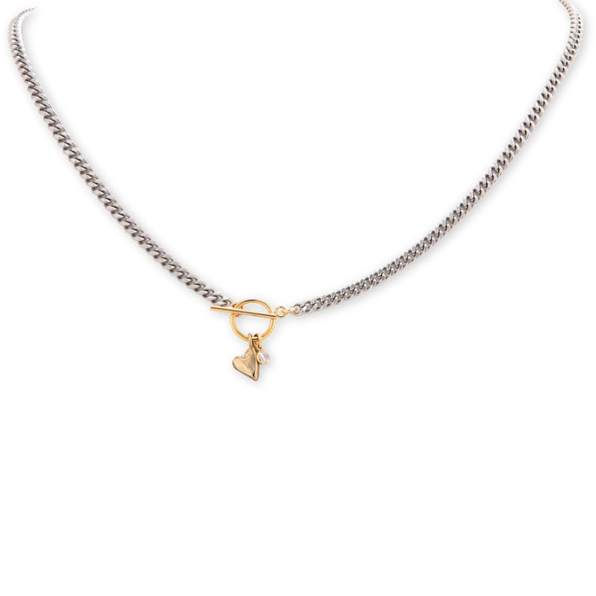 Silver curb chain necklace with a gold toggle clasp and a small gold heart charm with a tiny pearl, on white