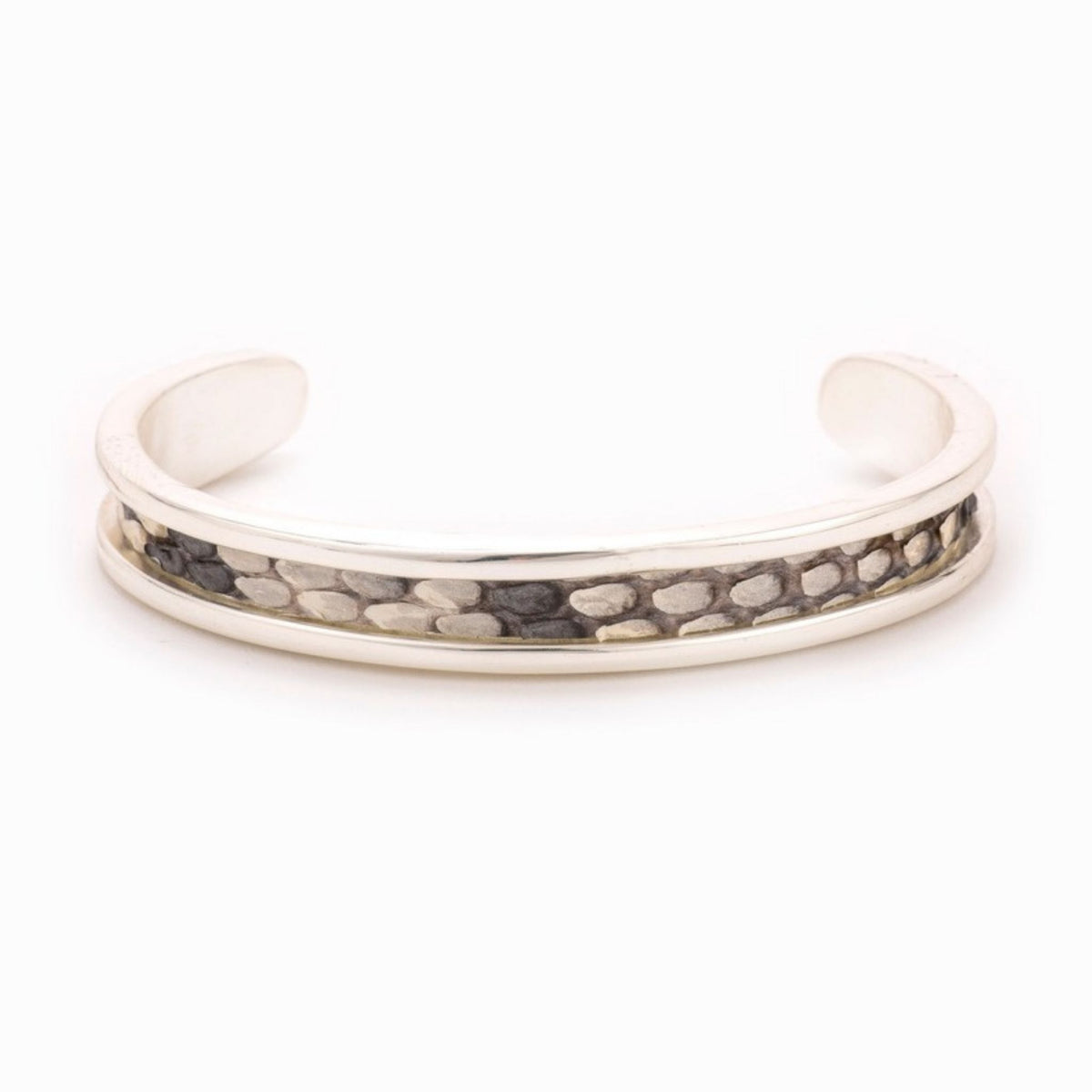 Small Taylor & Tessier cuff bracelet, .5in wide, front view, black and white python-embossed leather on a silver band