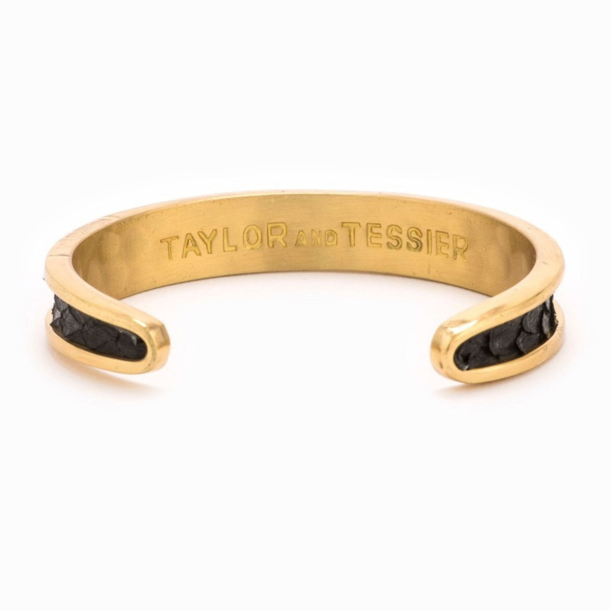 Small Taylor & Tessier cuff bracelet, .5in wide, inside view, black python-embossed leather on a gold band