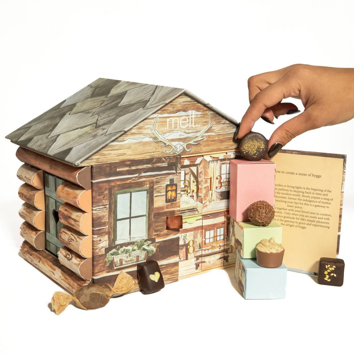 Wyoming log cabin chocolate advent calendar by Melt Chocolates, inspired by Swiss alpine farm chalets and hand-painted