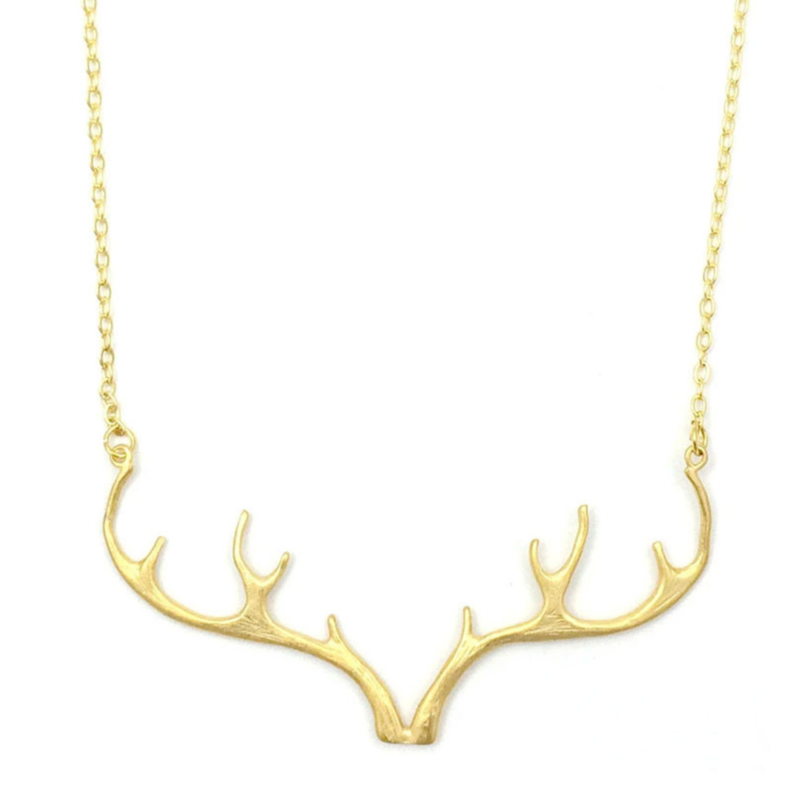a gold chain with an antler pendant