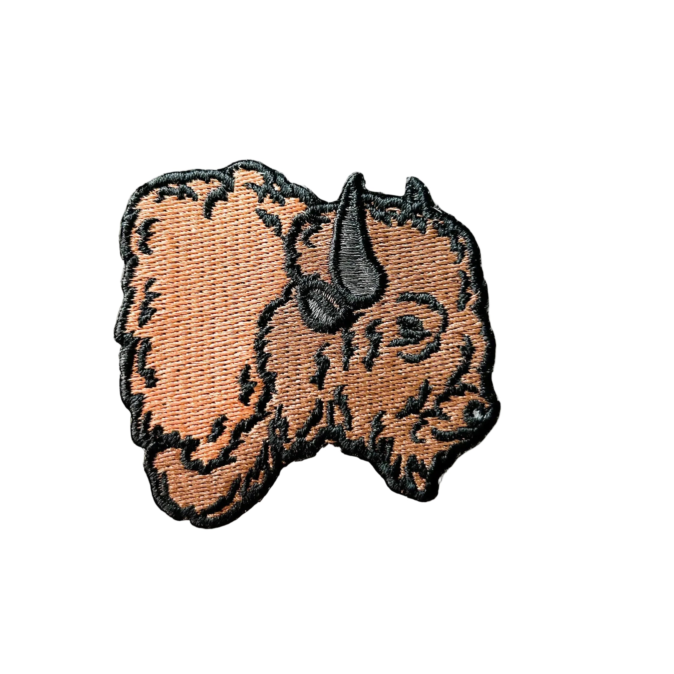 Embroidered iron on patch of a buffalo head.