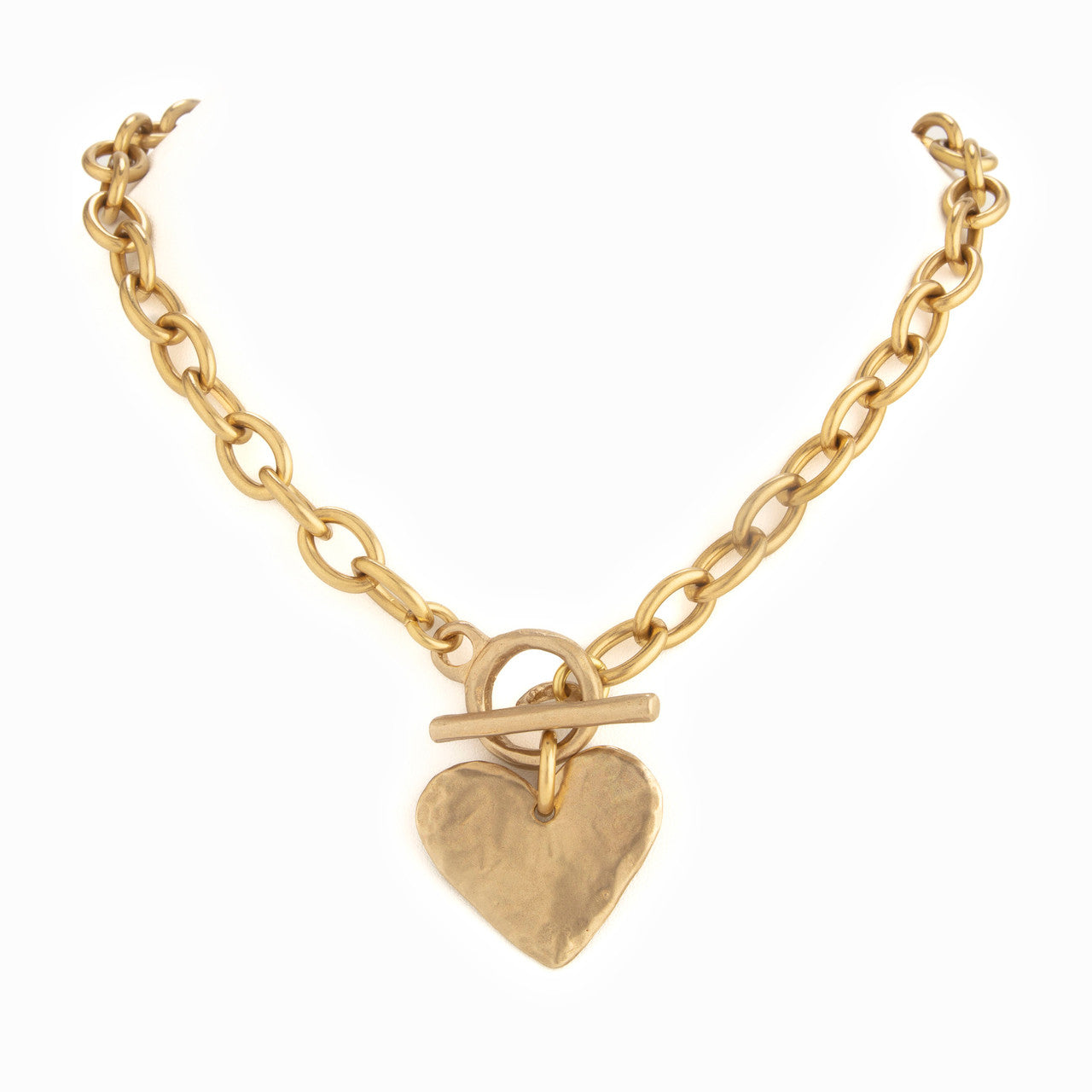 Gold chain necklace with a heart-shaped pendant on a white background