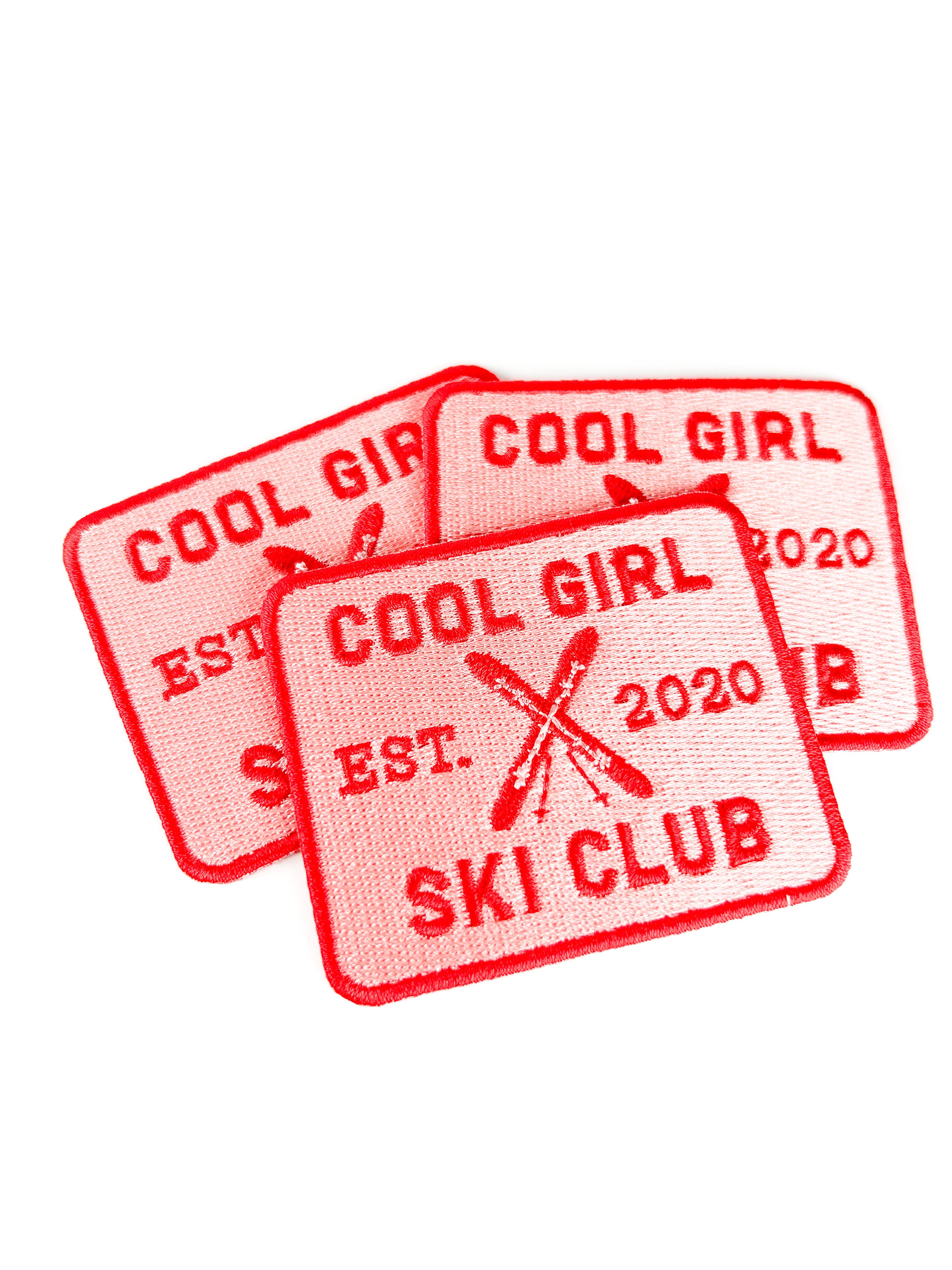 Embroidered iron on patch with 'Cool Girl Ski Club' text and ski design.