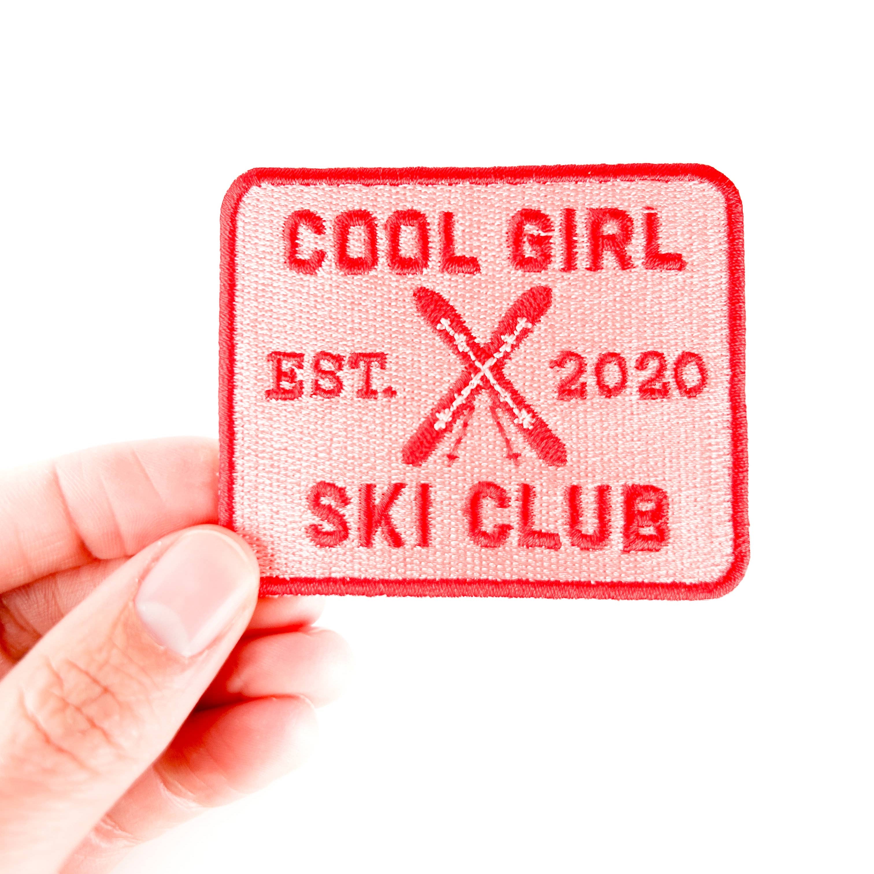 Embroidered iron on patch with 'Cool Girl Ski Club' text and ski design.