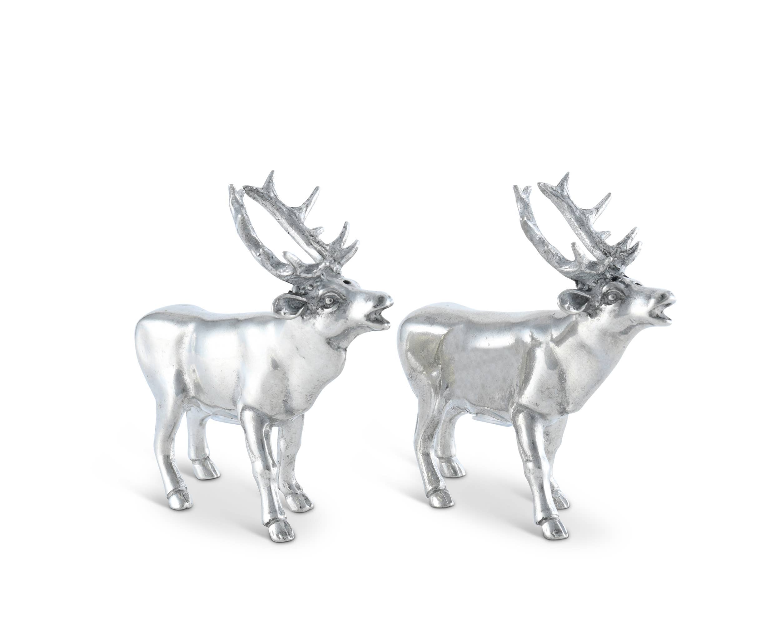 Two silver deer figurines on a white background