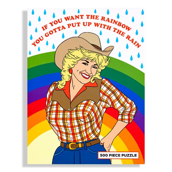 Puzzle box with a cowboy woman, rainbow, and raindrop design on a white background