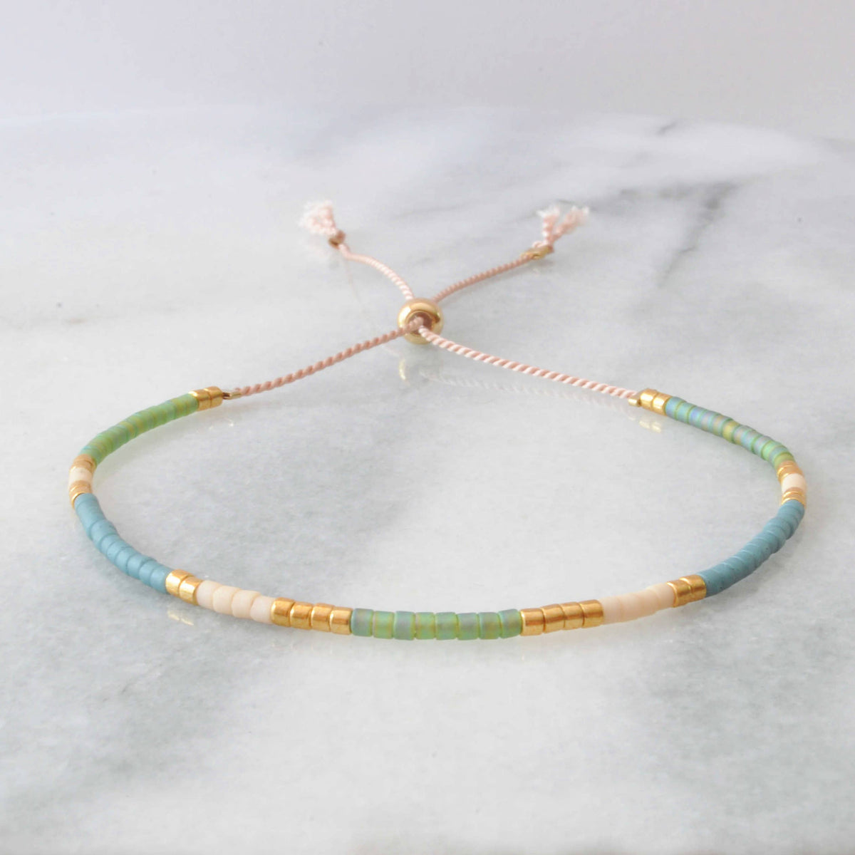 Beaded bracelet with gold accents.