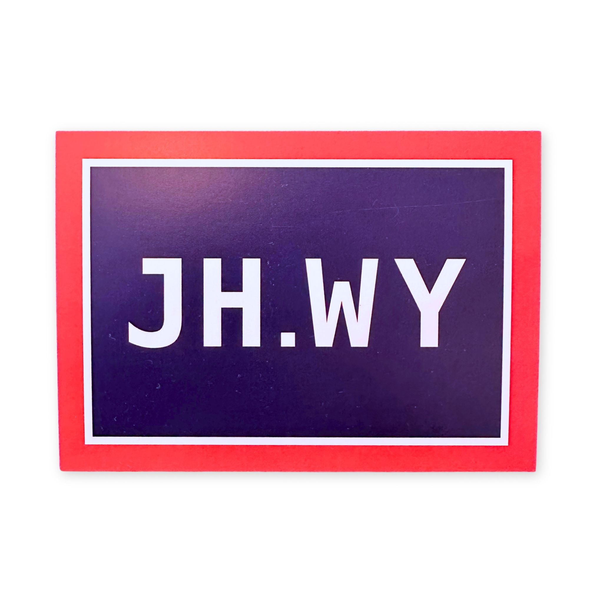Postcard depicting the wyoming flag, only instead of the bison it is "JH.WY"