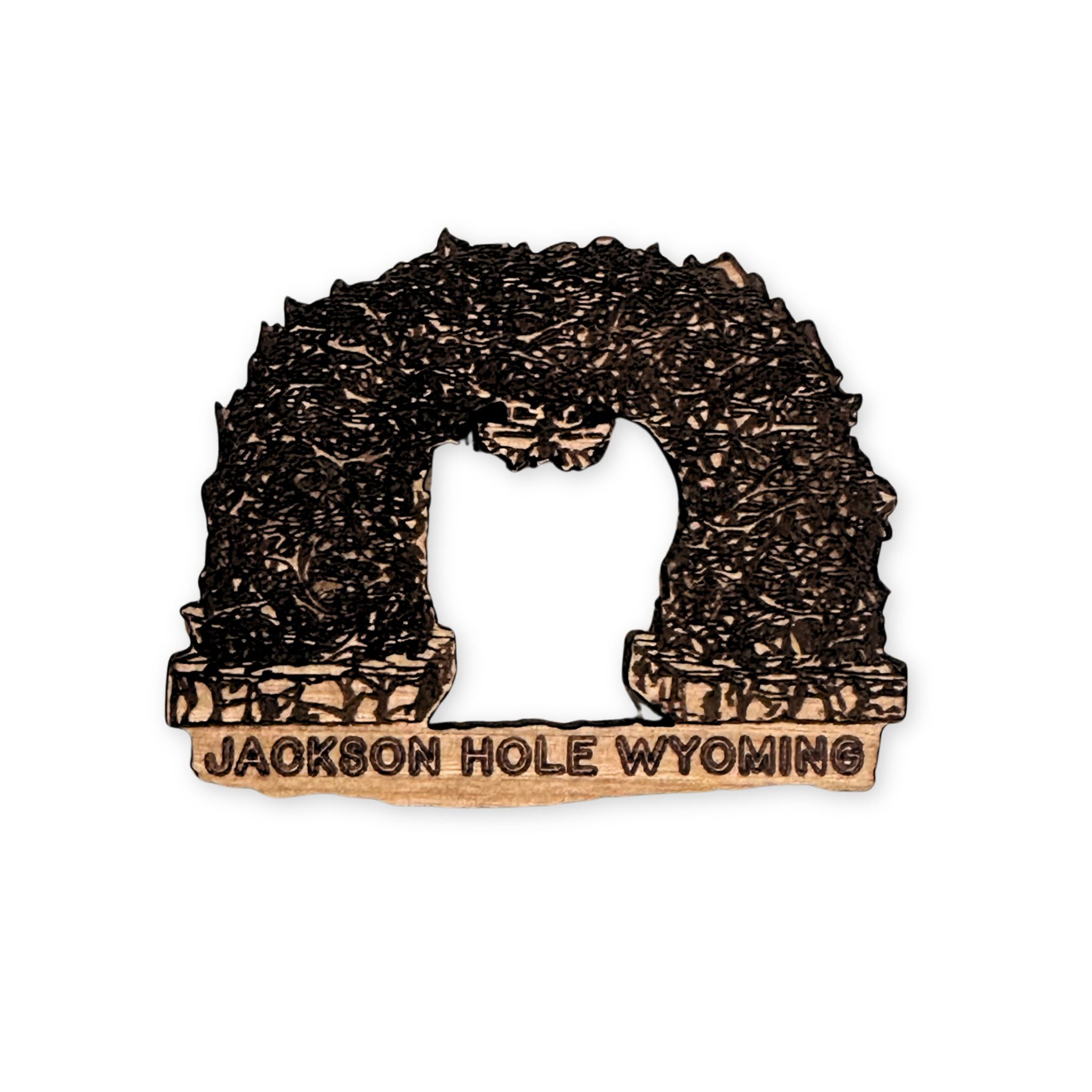 Wooden antler arch-shaped magnet with 'Jackson Hole Wyoming' text on a white background