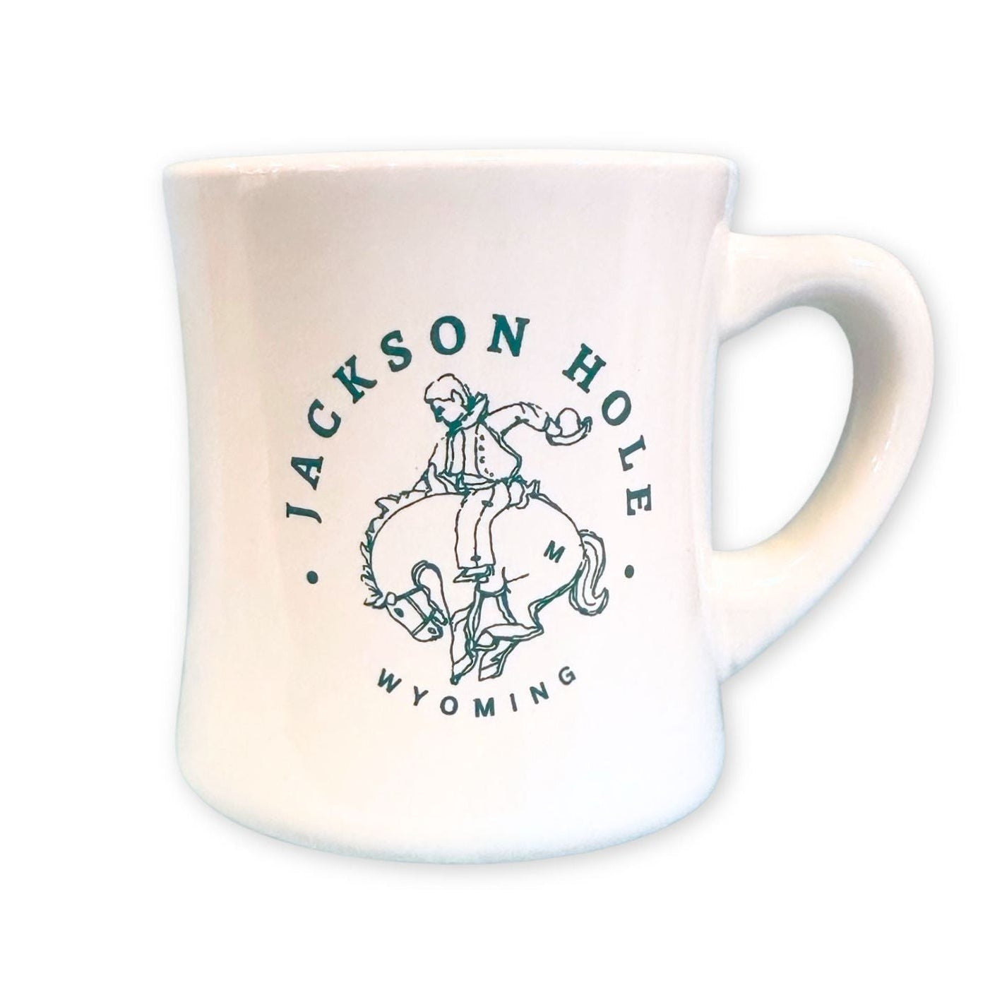 A diner style mug, with a cowboy bucking bronco design in green. Along with Jackson Hole Wyoming in green text.