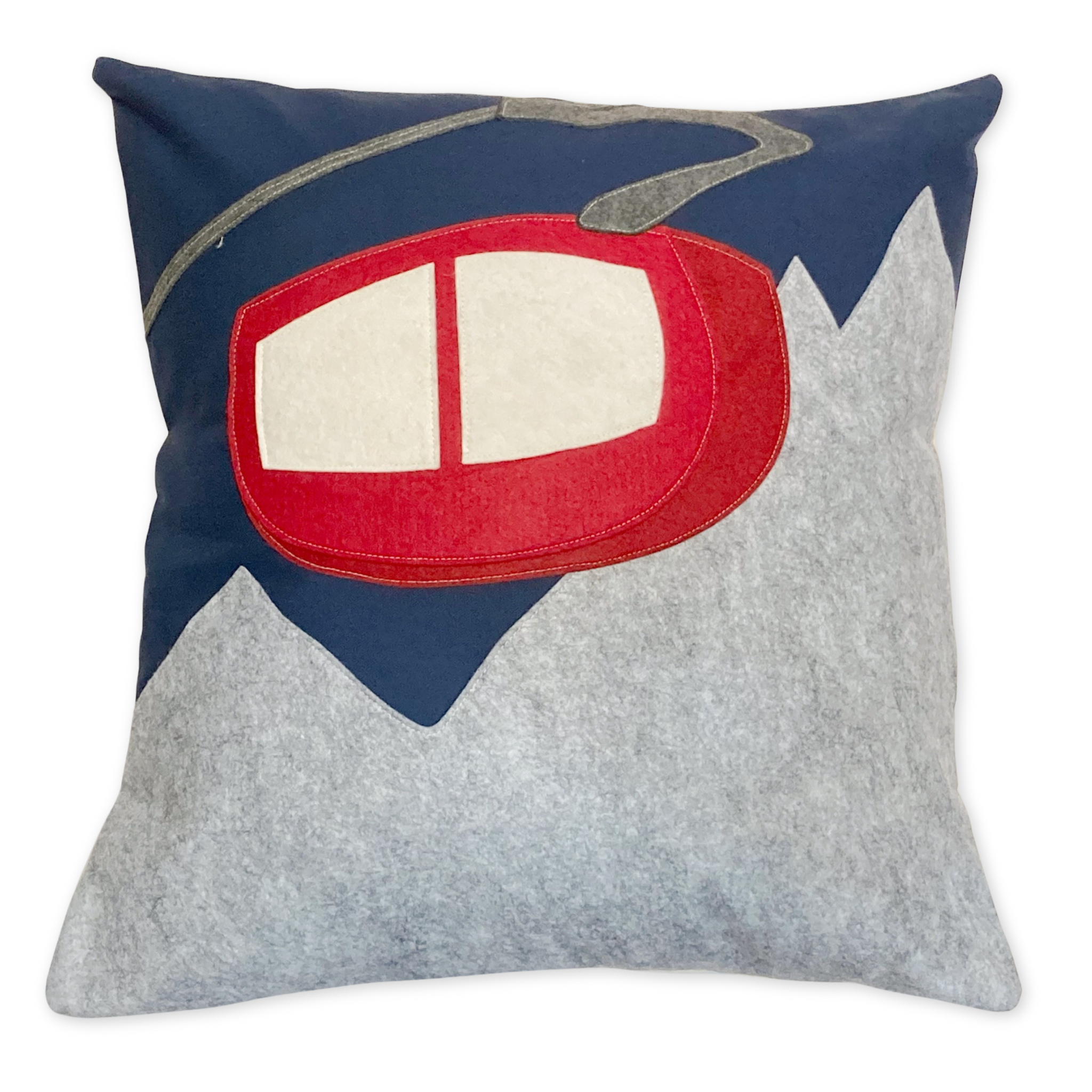 wool and felt pillow with a mountain range and a tram design