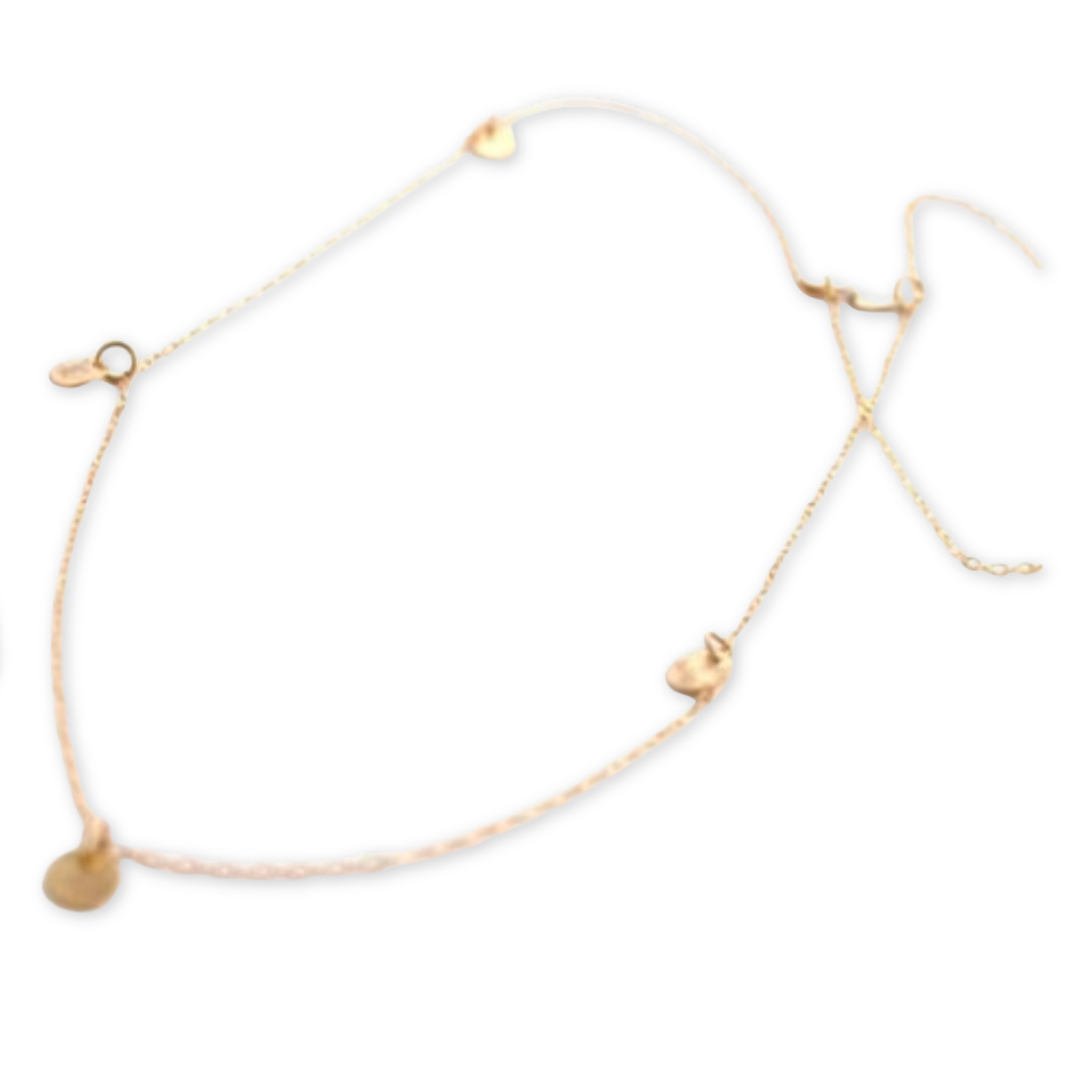 long delicate chain necklace with tiny hand hammered discs hanging from it