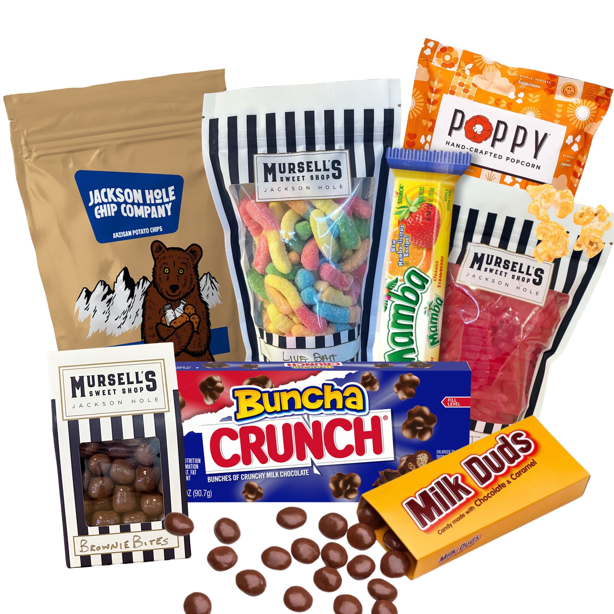 Assorted snacks including candy, popcorn, and chocolate bars on a white background