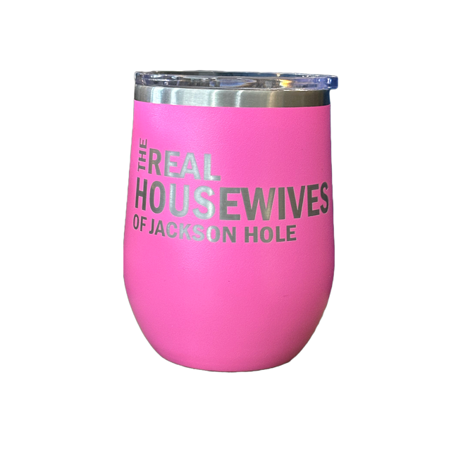 A pink stainless steel stemless wine glass with the text 'THE REAL HOUSEWIVES OF JACKSON HOLE' printed on the side.