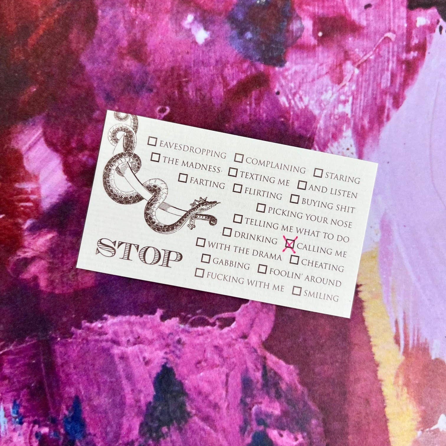 Card with text and design on a pink and purple abstract background