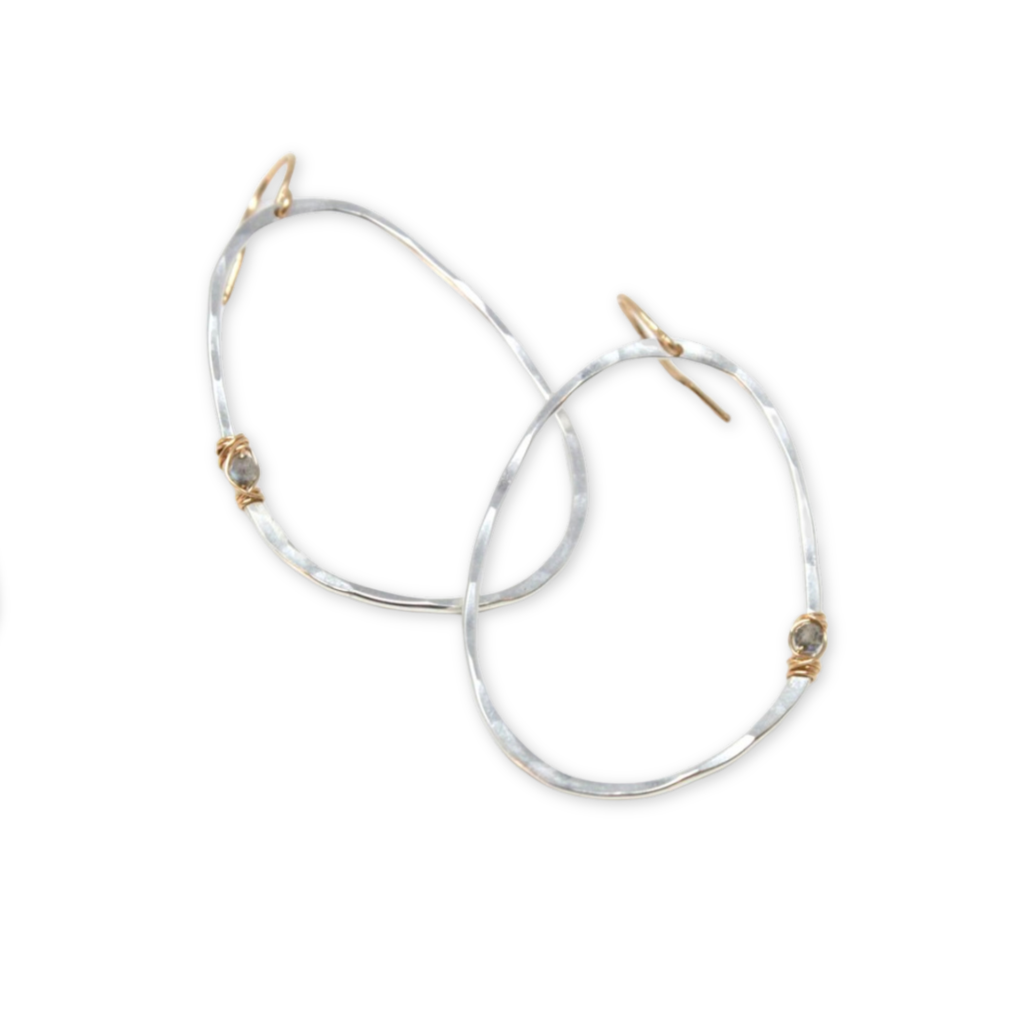 hammered organic shaped oval pendants with a single labradorite stone wired on the side hanging on ear wire