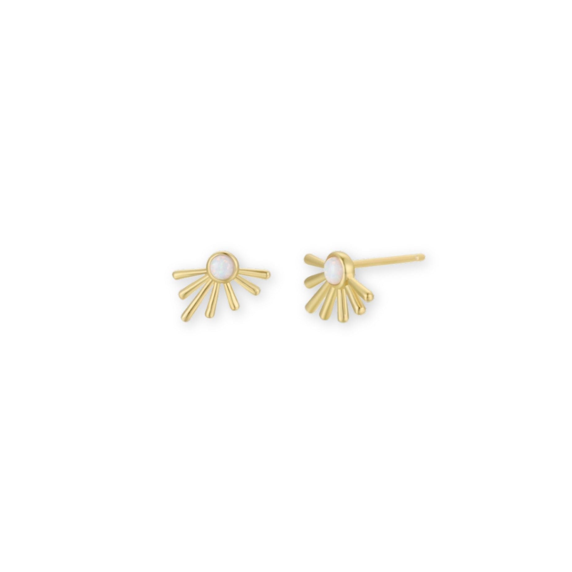 Gold sunburst earrings with white opal centers on a white background