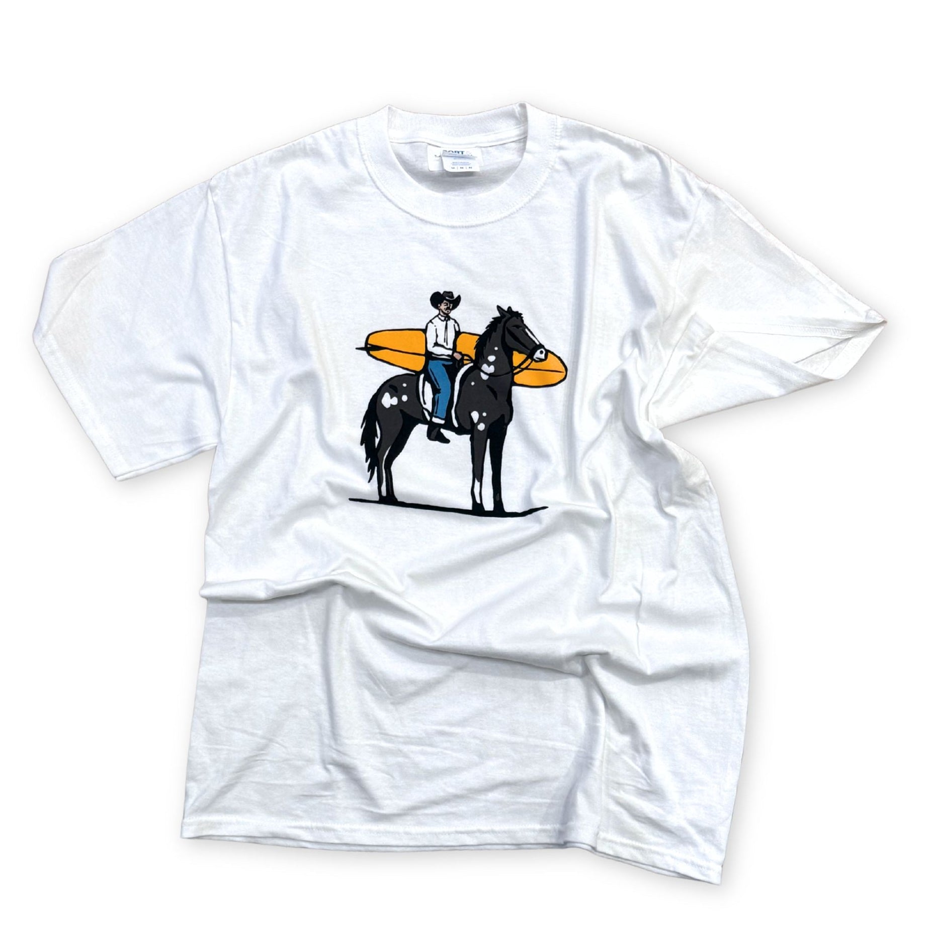 White t-shirt with a cowboy on a horse and a surf board