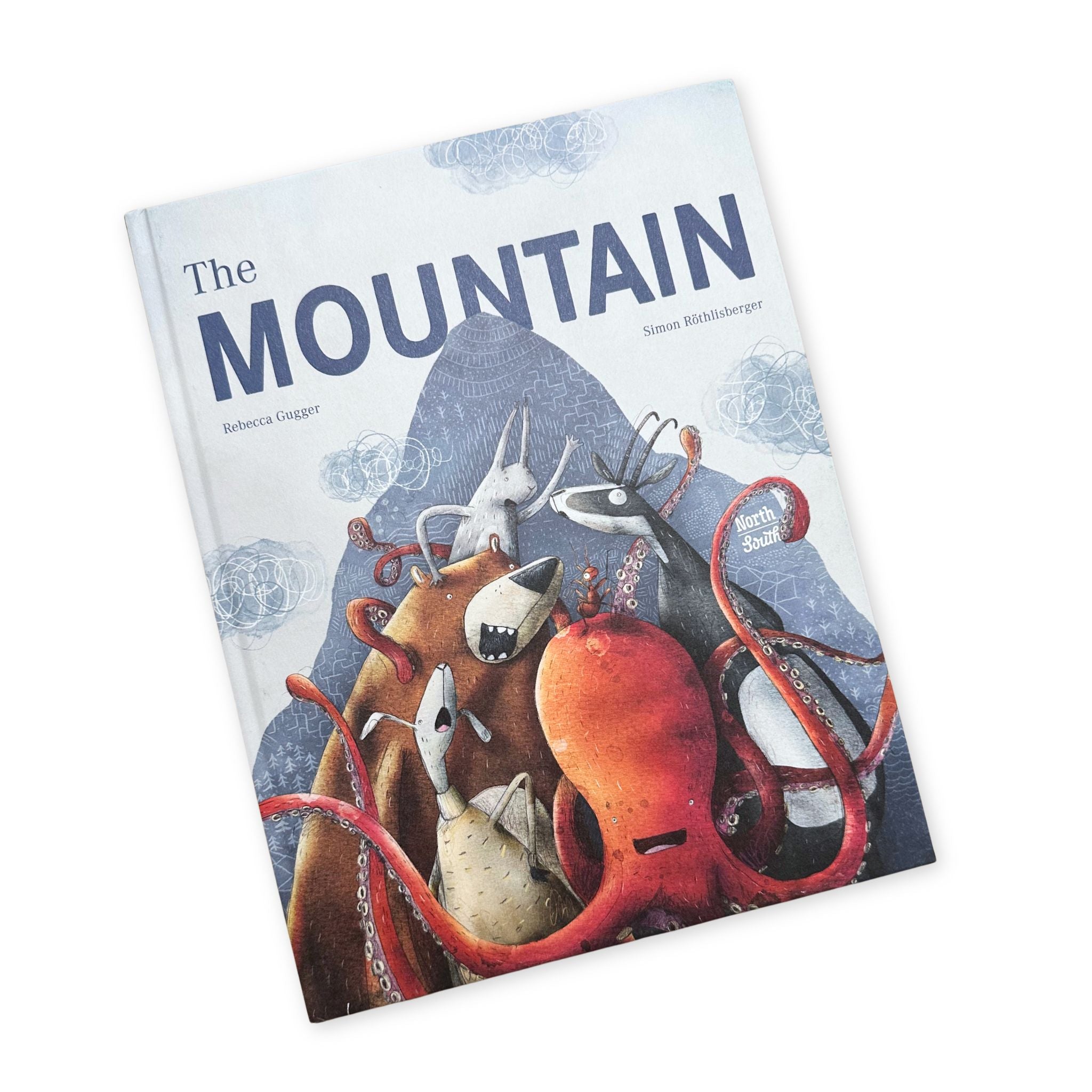 Book with "The Mountain" as the title. Front cover shows a bunch of animals in front of a mountain.