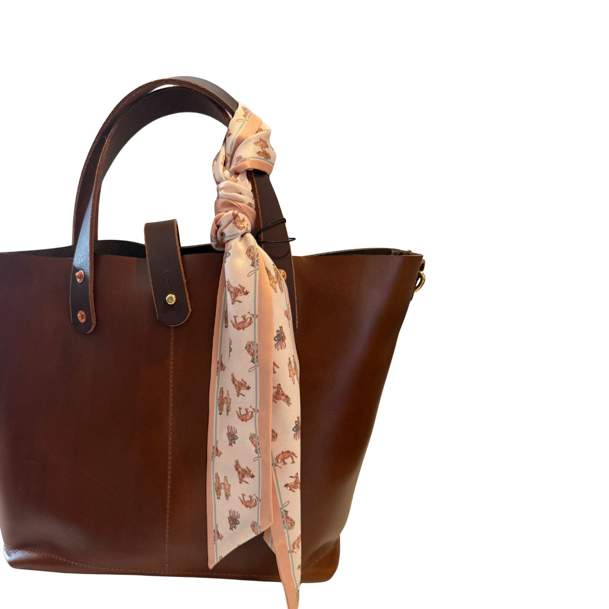 Brown leather handbag with a patterned Twilly draped over the handle Western Theme