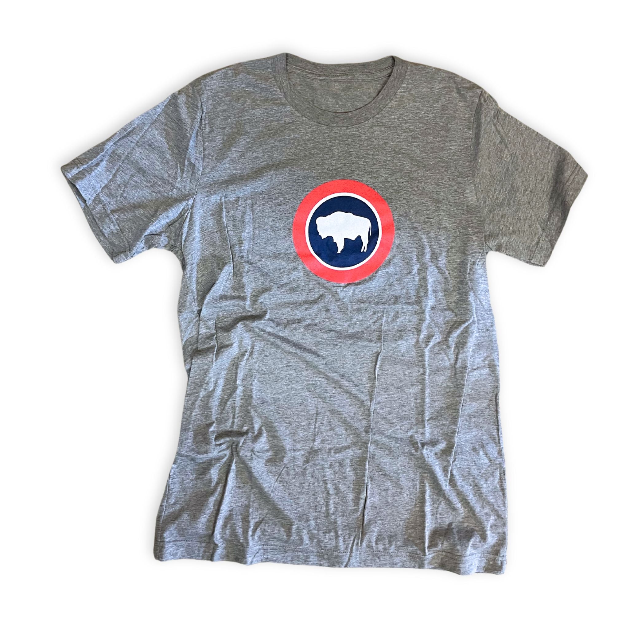 A gray t-shirt with a circular logo featuring a bison in the center, with a red and white ring around it, on a white background.