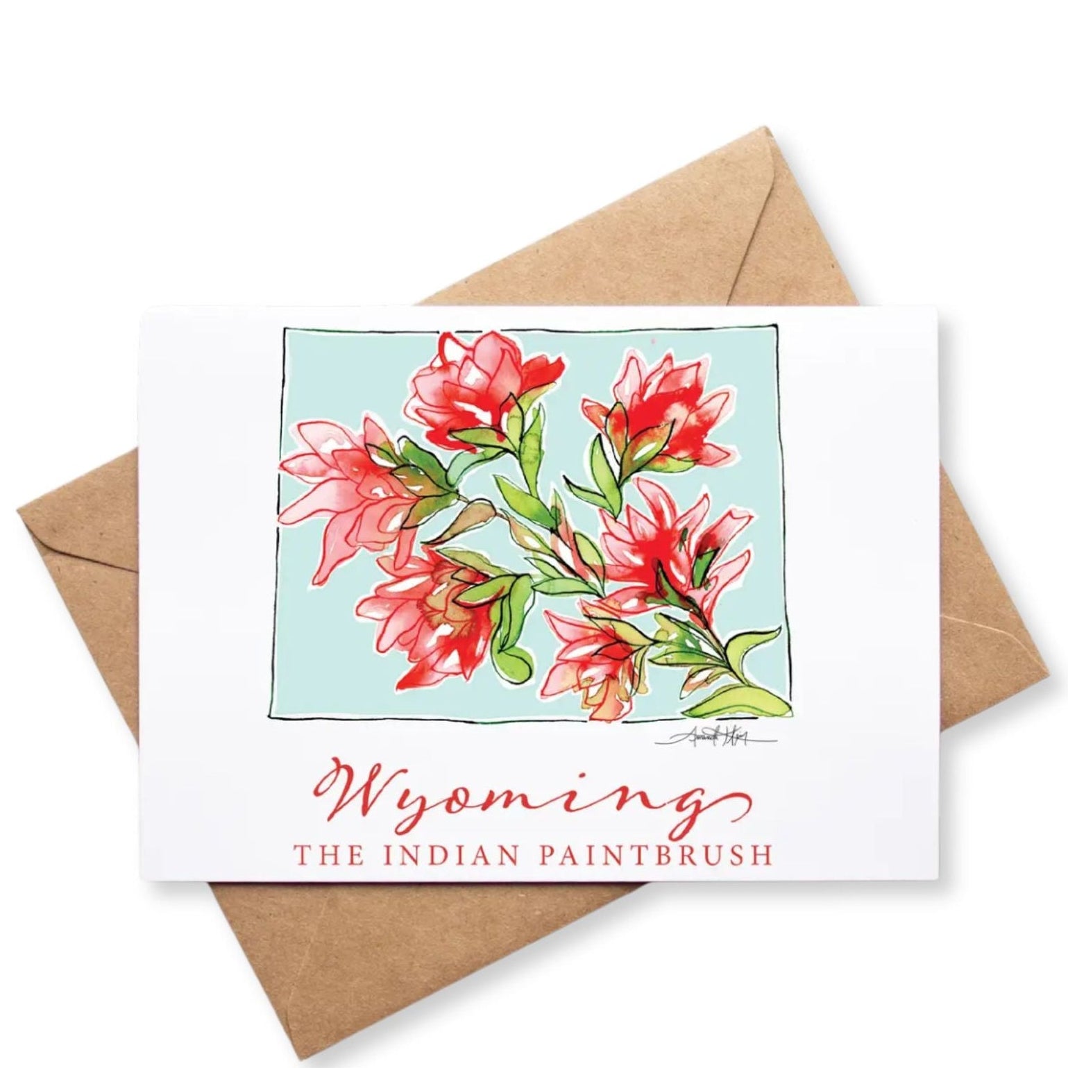 Card with red flowers and 'Wyoming The Indian Paintbrush' text, featuring a brown envelope on a white background.