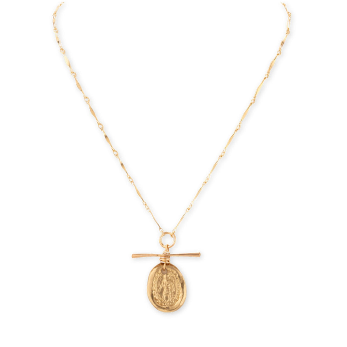 Thin gold bar-link chain necklace with a T-bar toggle and an oval gold saint medal pendant on white
