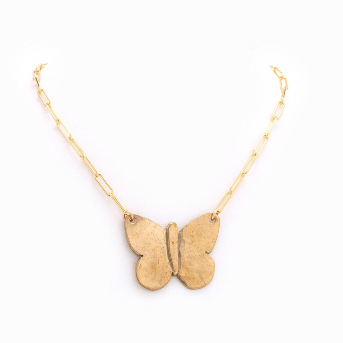 Flight Gold Butterfly Necklace by Taylor & Tessier, a gold paperclip chain with a hammered gold butterfly pendant