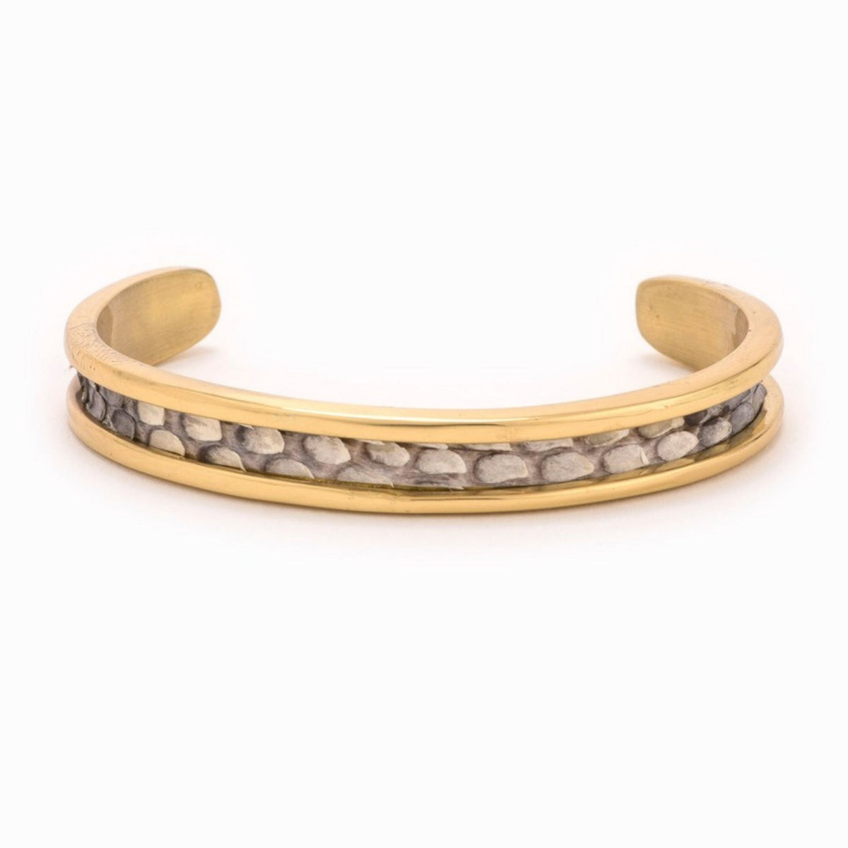 Small Taylor & Tessier cuff bracelet, .5in wide, front view, black and white python-embossed leather on a gold band