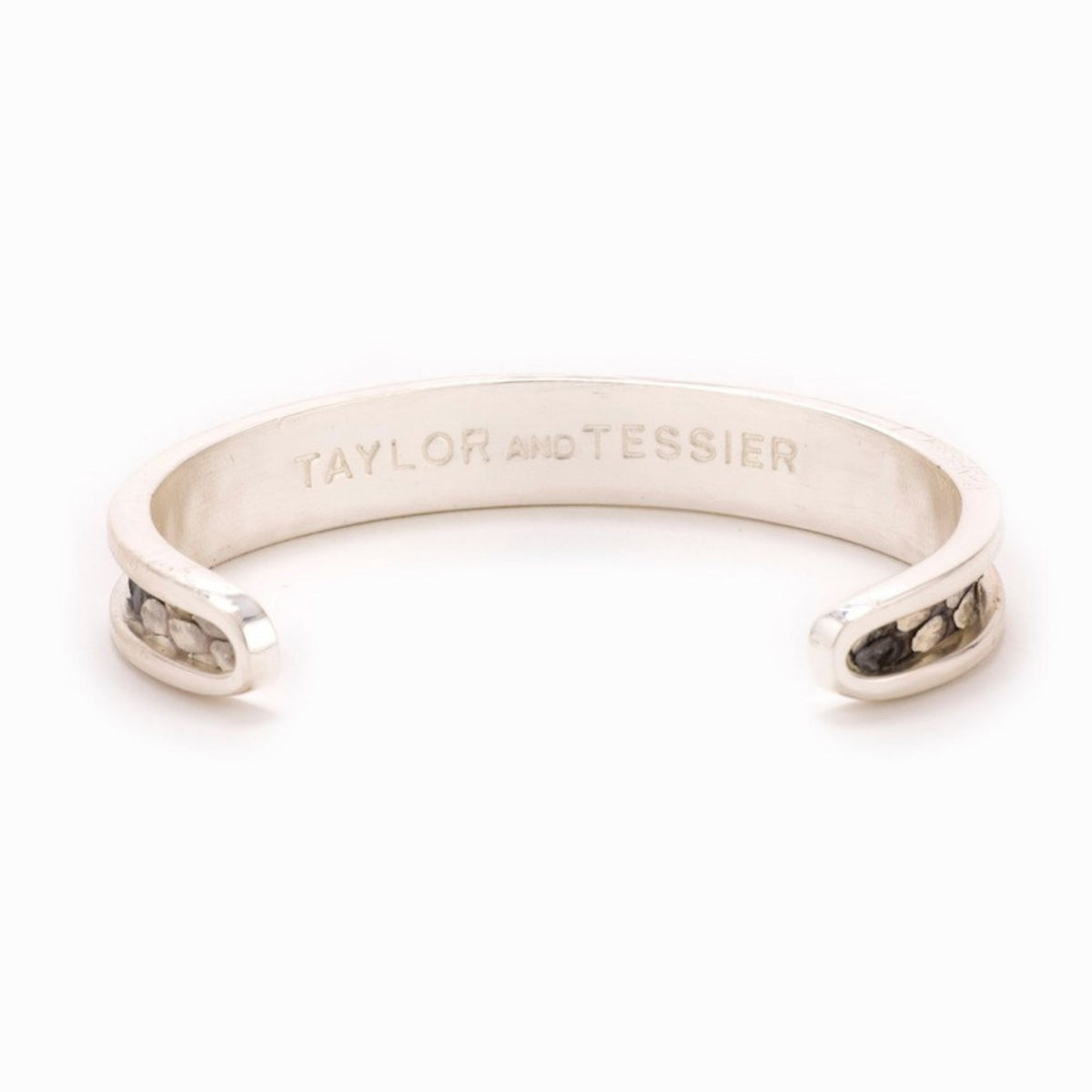 Small Taylor & Tessier cuff bracelet, .5in wide, inside view, black and white python-embossed leather on a silver band