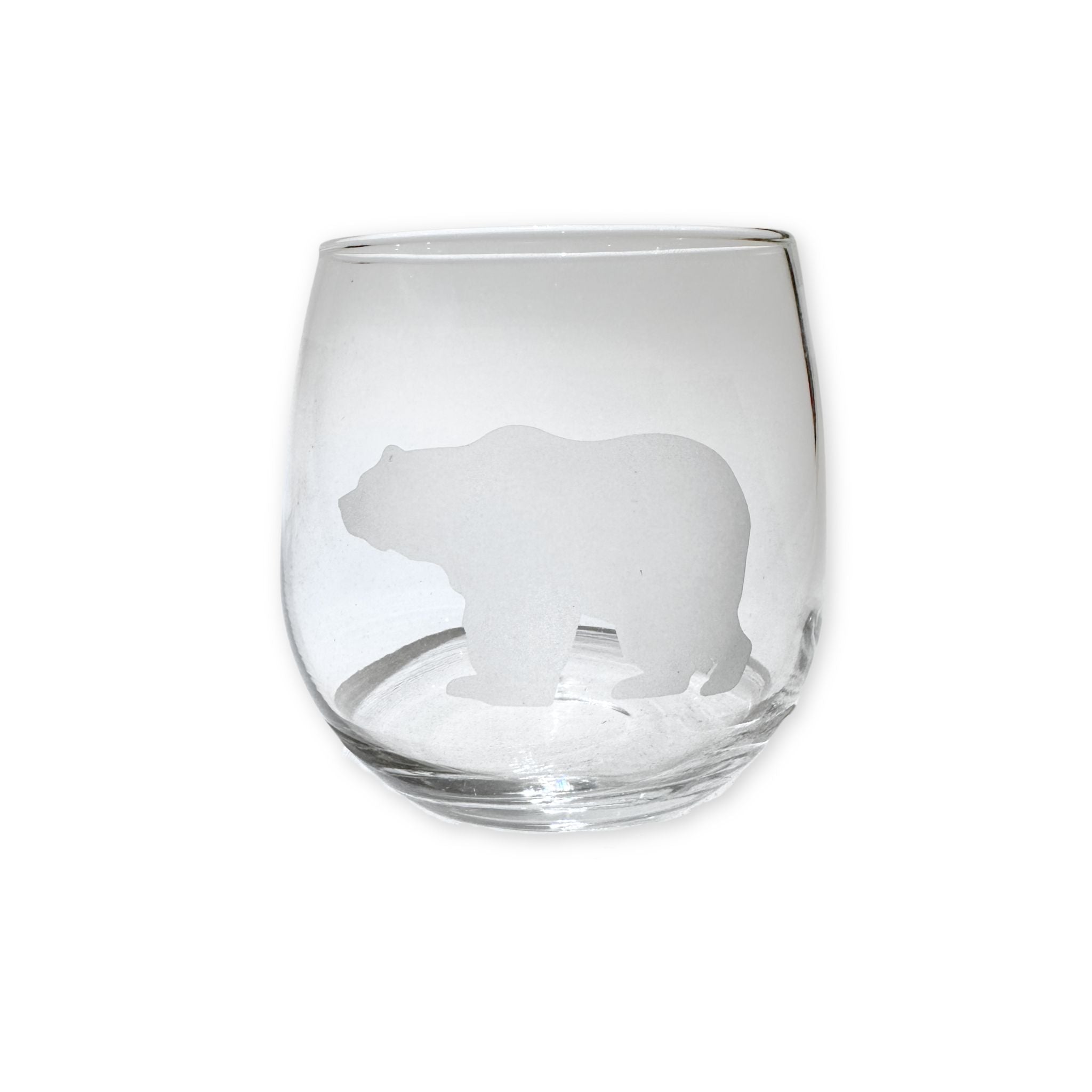 Clear glass with bear etching on a white background
