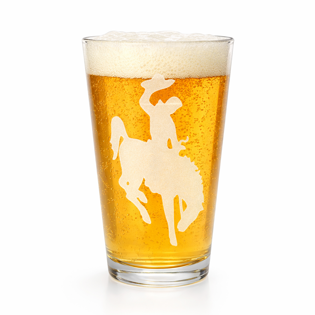 Pint glass with a horse and rider silhouette on a white background
