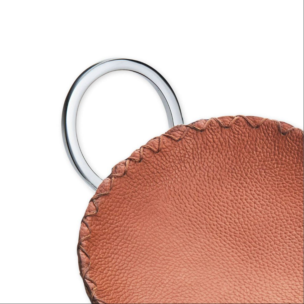 Brown leather keychain with a silver ring on a white background
