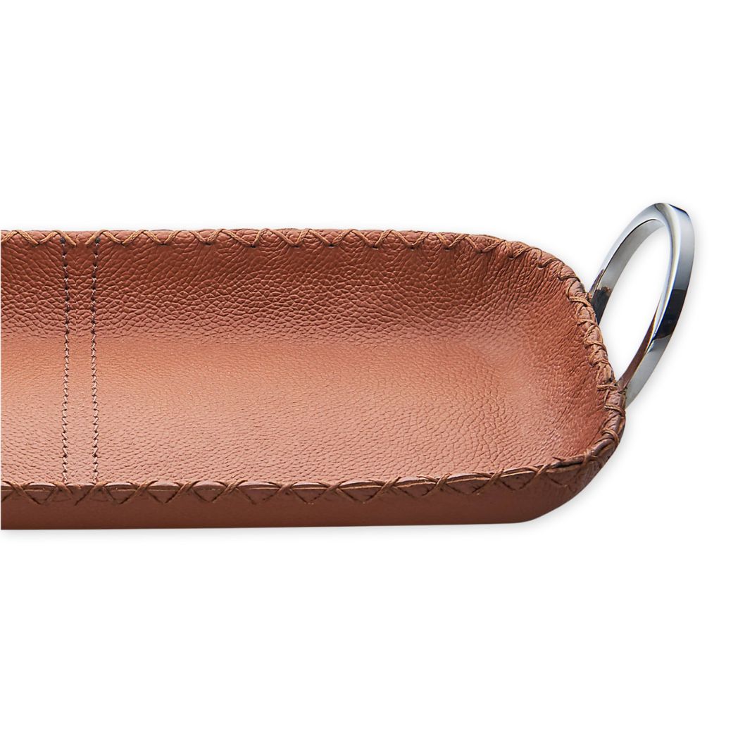 Brown leather key case with metal key ring on a white background