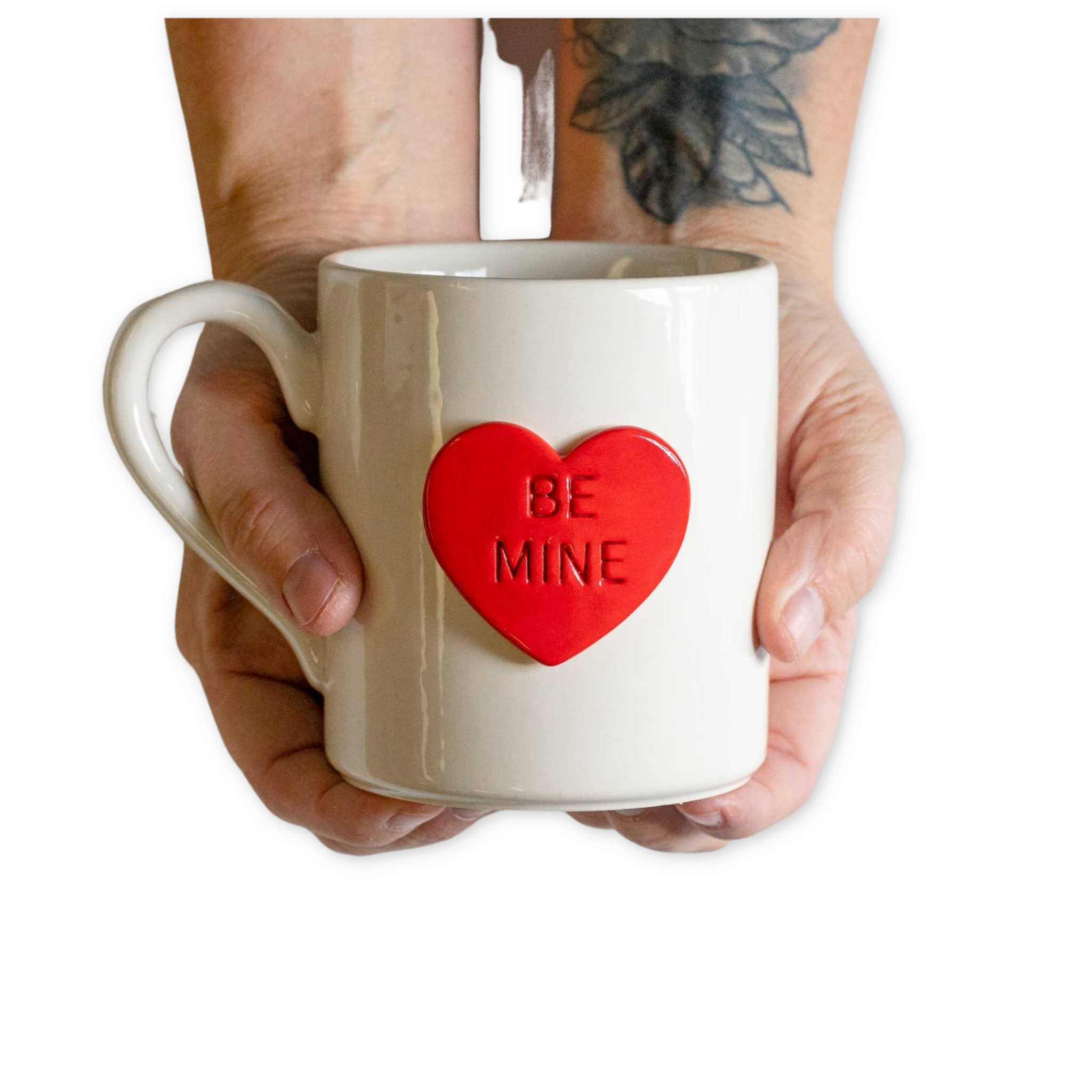 ceramic mug with a heart containing a phrase