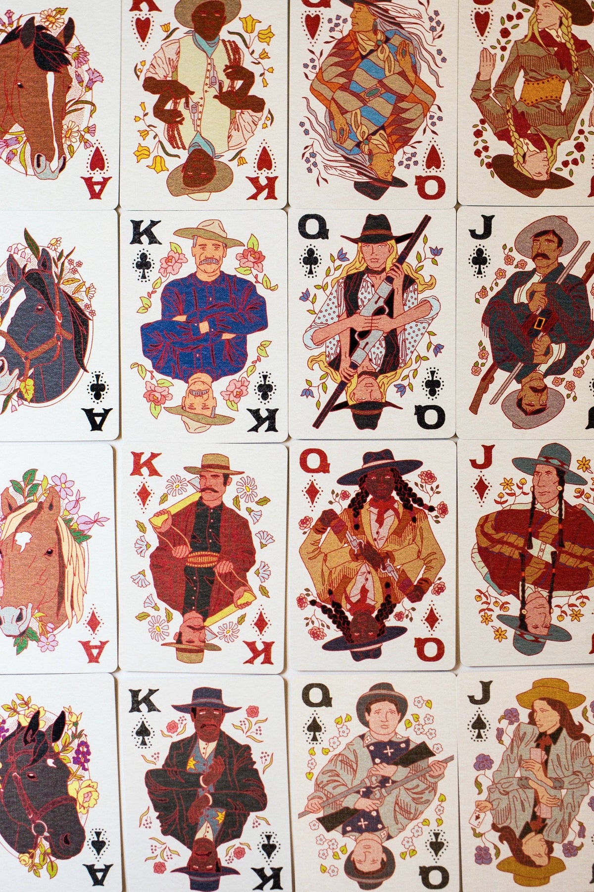 A set of playing cards featuring Western-themed illustrations, including horses, cowboys, and figures in vintage western clothing, arranged in a grid pattern.