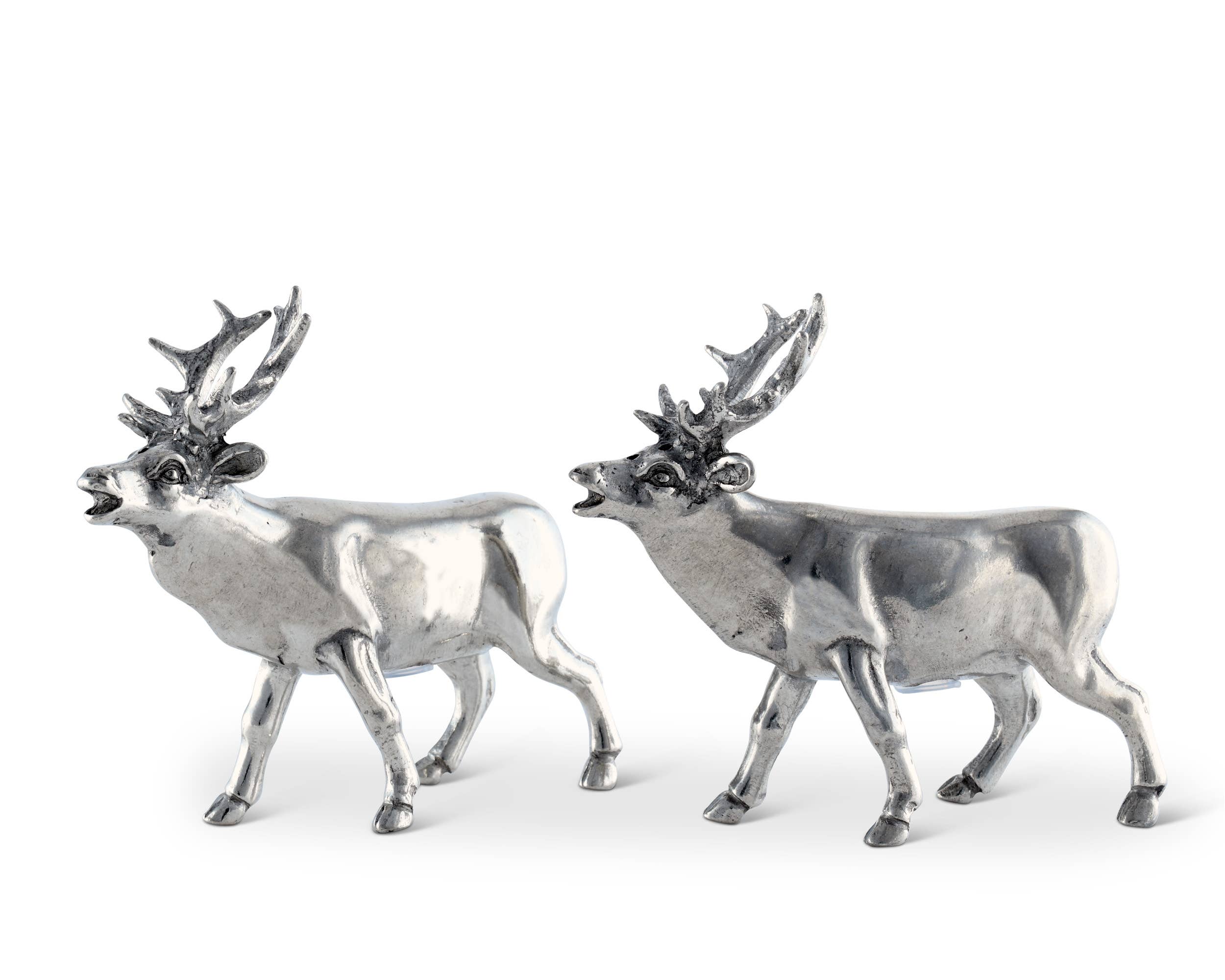 Two silver deer figurines on a white background