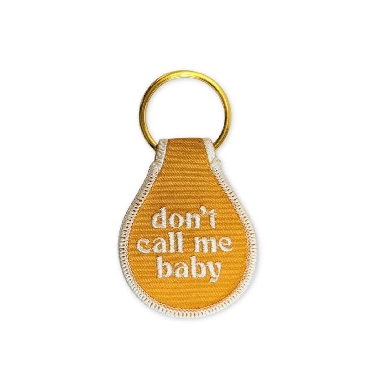 Don't call me baby keychain in yellow.