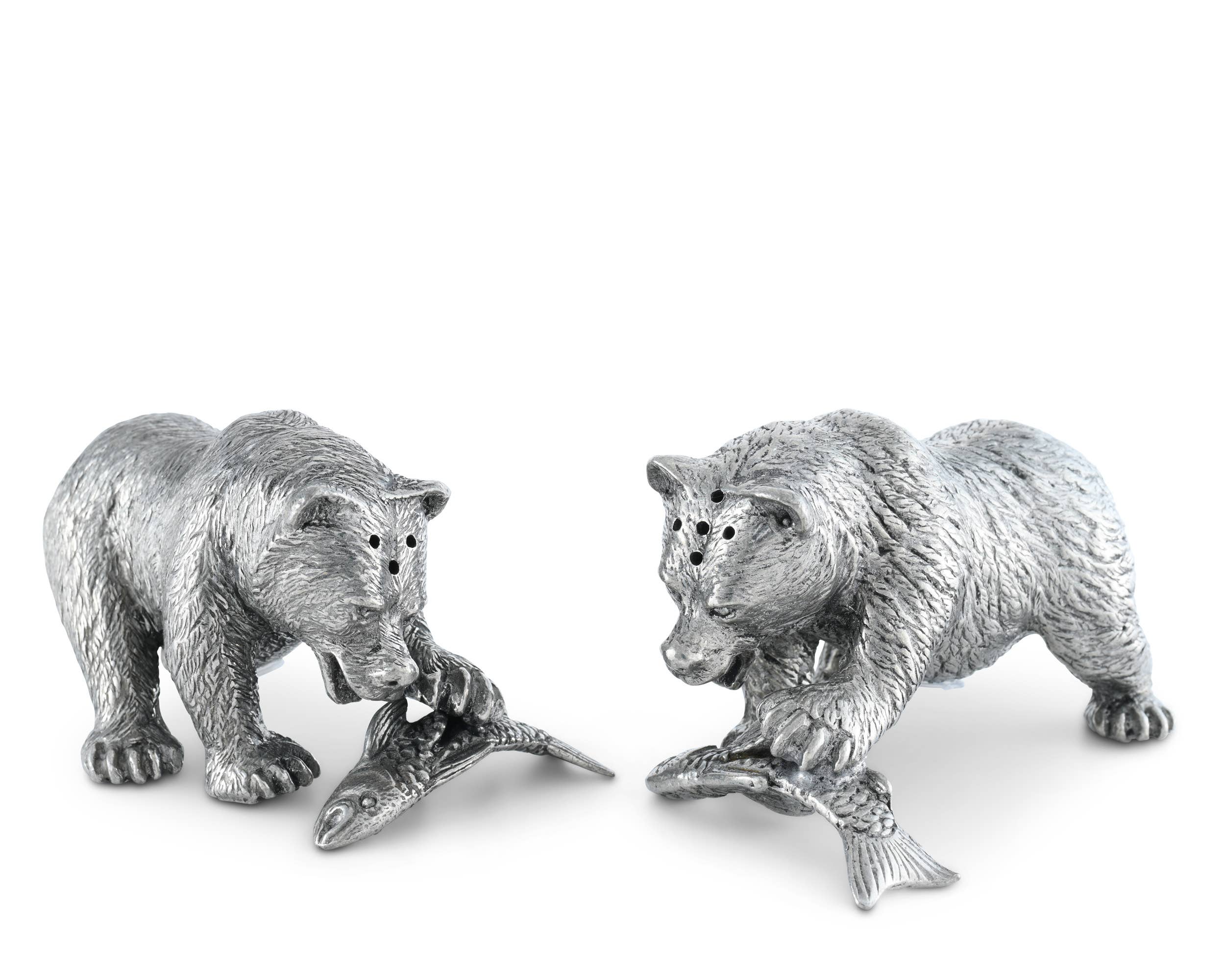 Two silver bear figurines on a white background