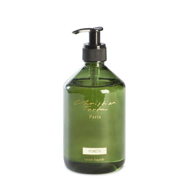 Green bottle with pump dispenser on a white background