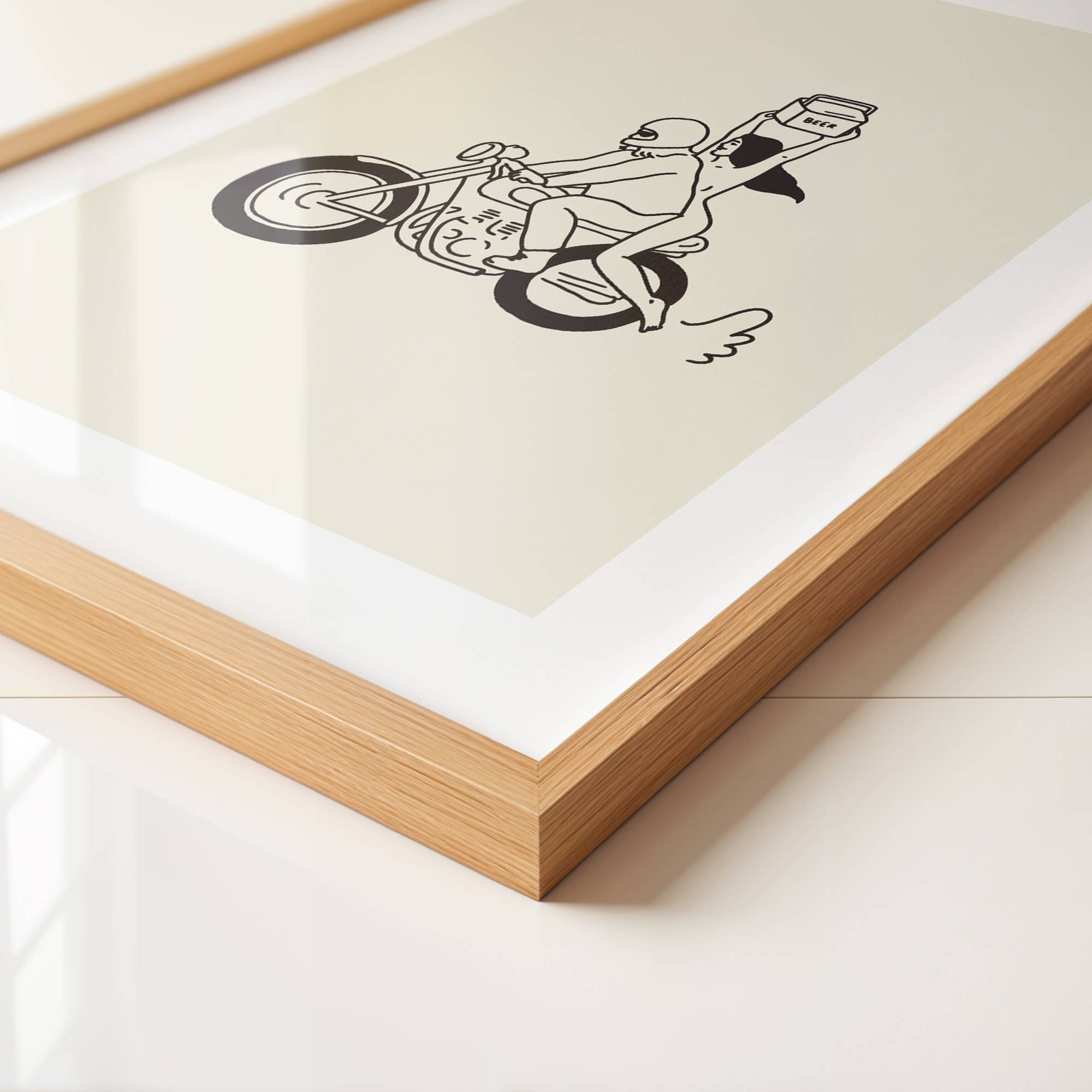 Framed artwork of a black line drawing of a person on a bicycle with a dog.