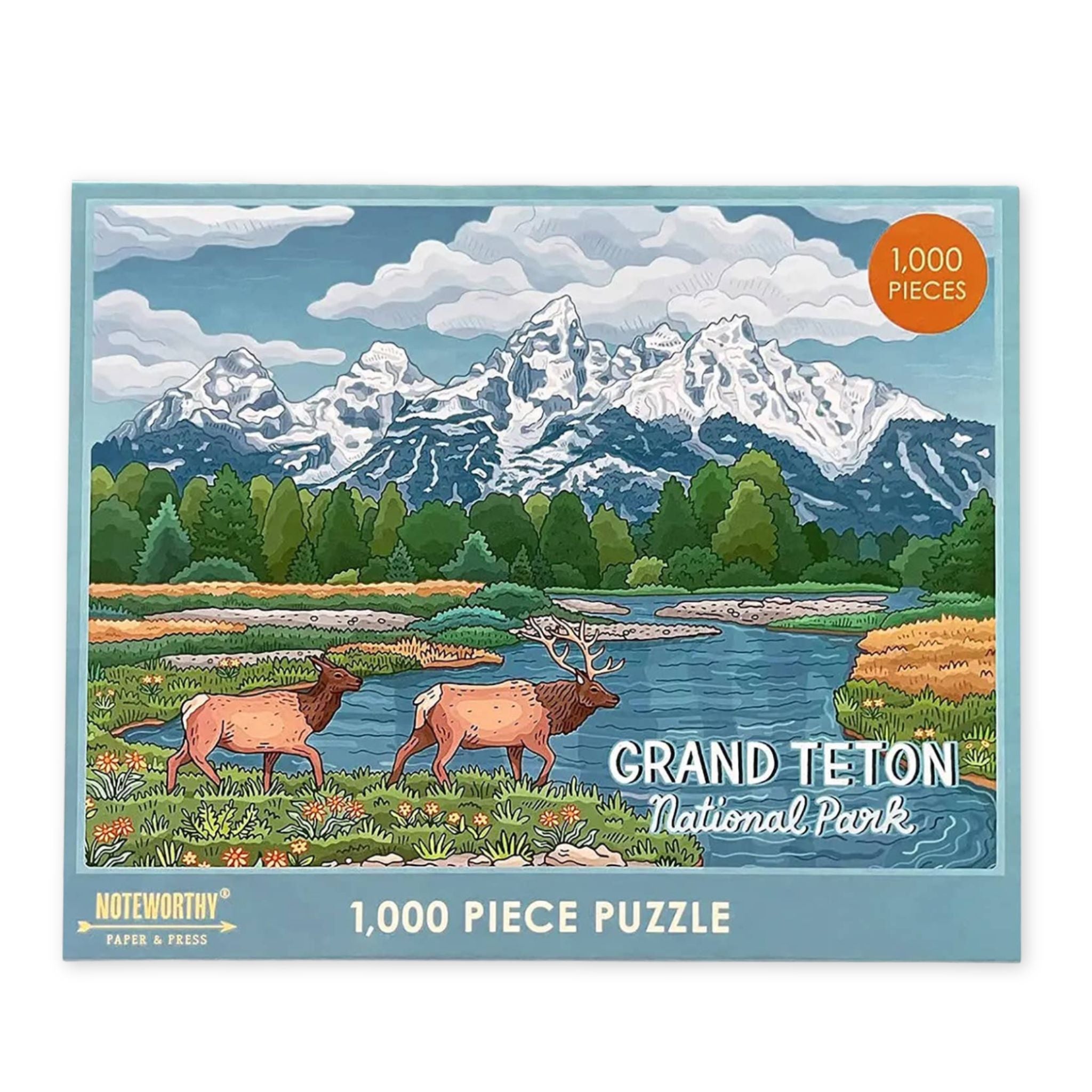 Jigsaw puzzle packaging featuring Grand Teton National Park with mountains and elk.