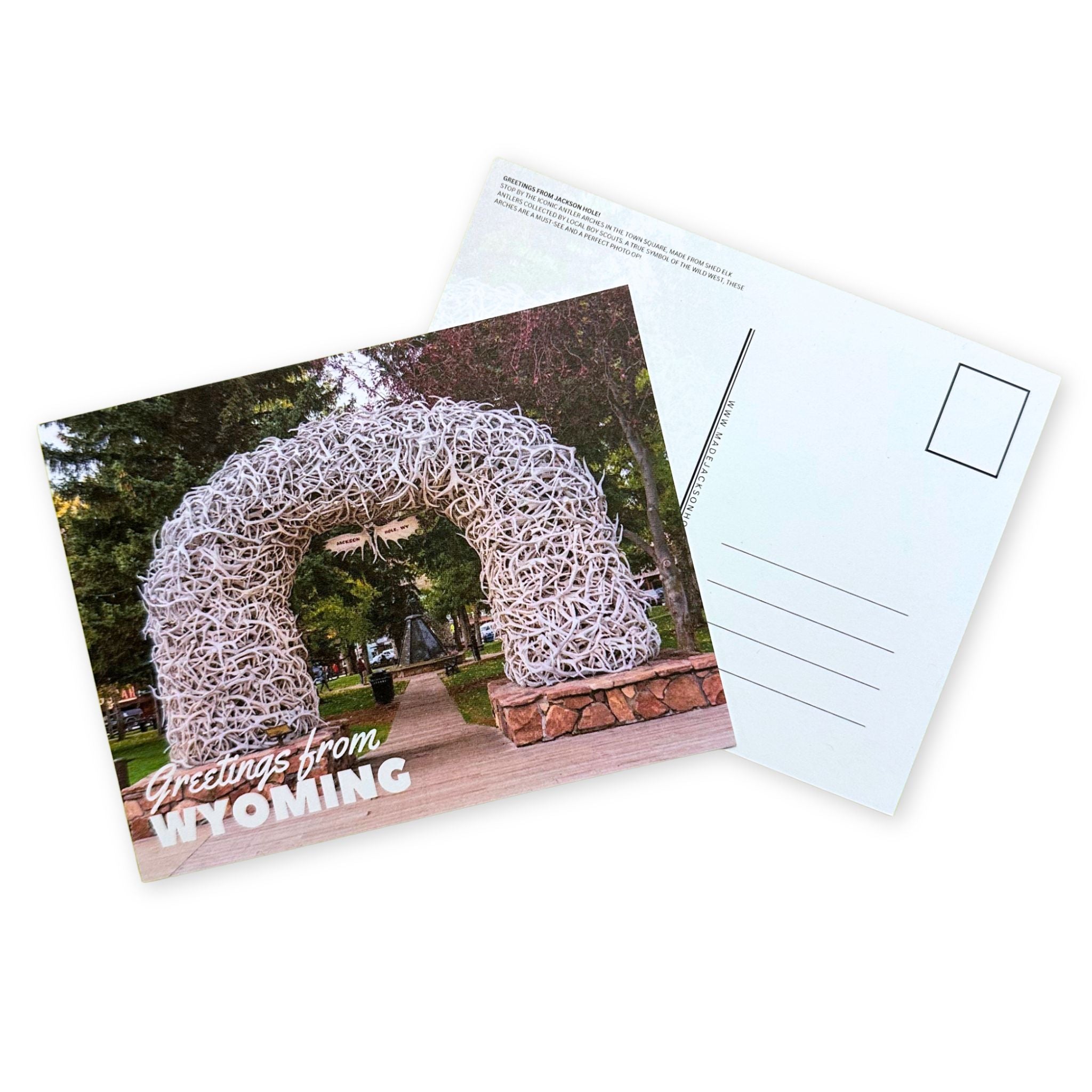 Postcard with Antler Arch sculpture and text stating "Greeting's From Wyoming"