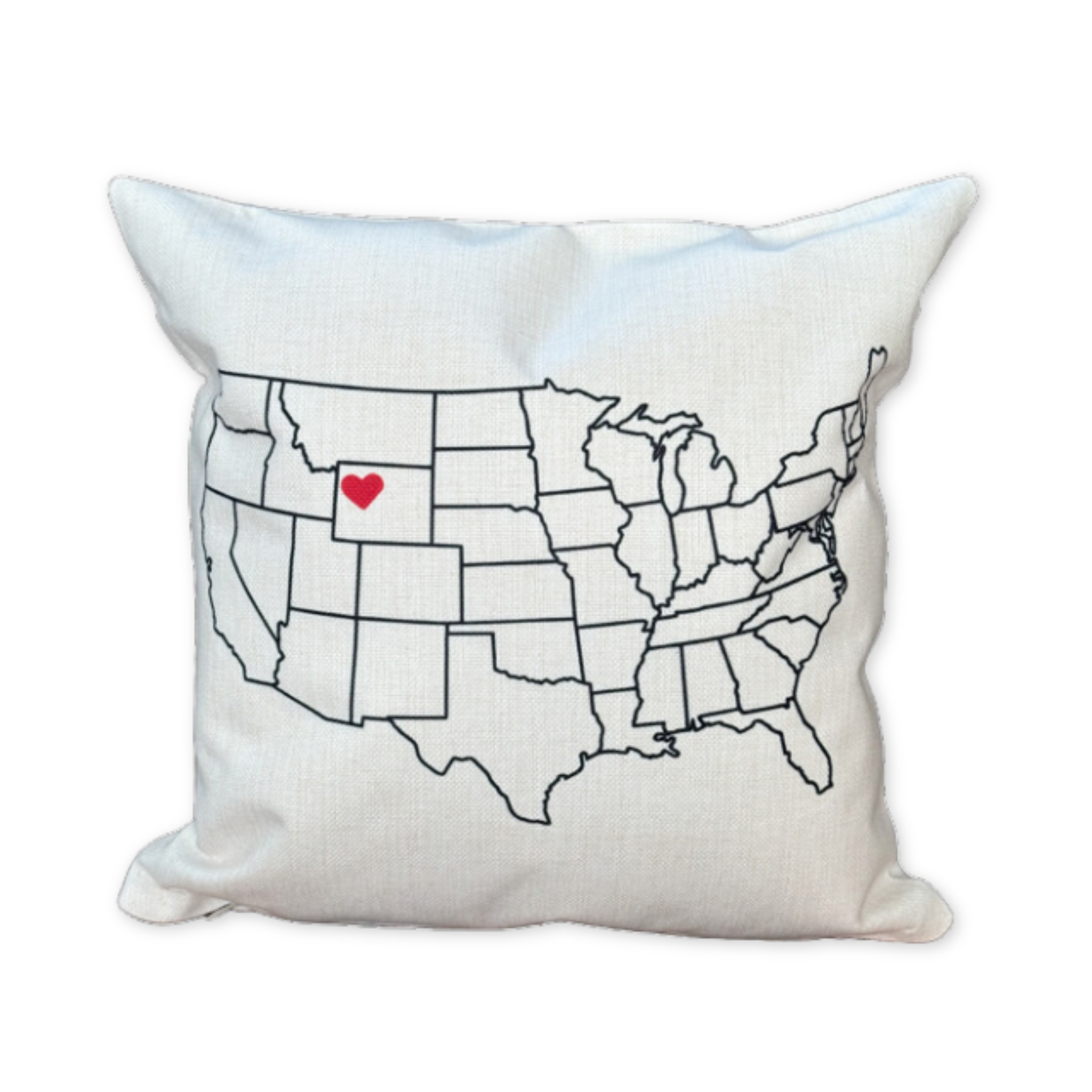 cotton pillow with a map of the united states and a heart icon over jackson hole wyoming