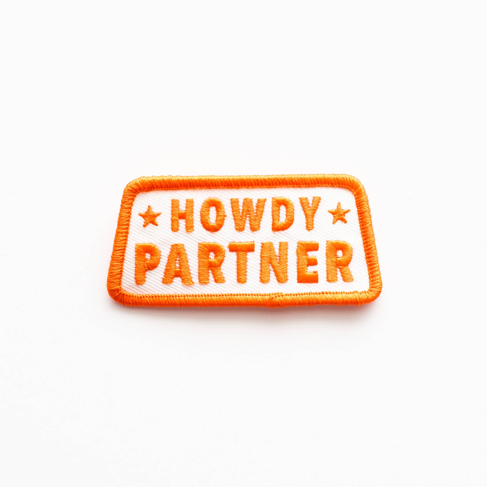 Embroidered patch with 'HOWDY PARTNER' text on a white background.