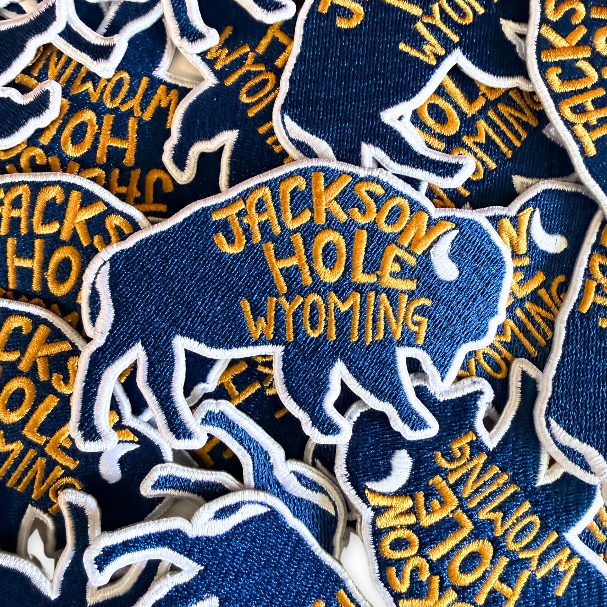 A blue bison with yellow lettering that reads "Jackson Hole Wyoming"