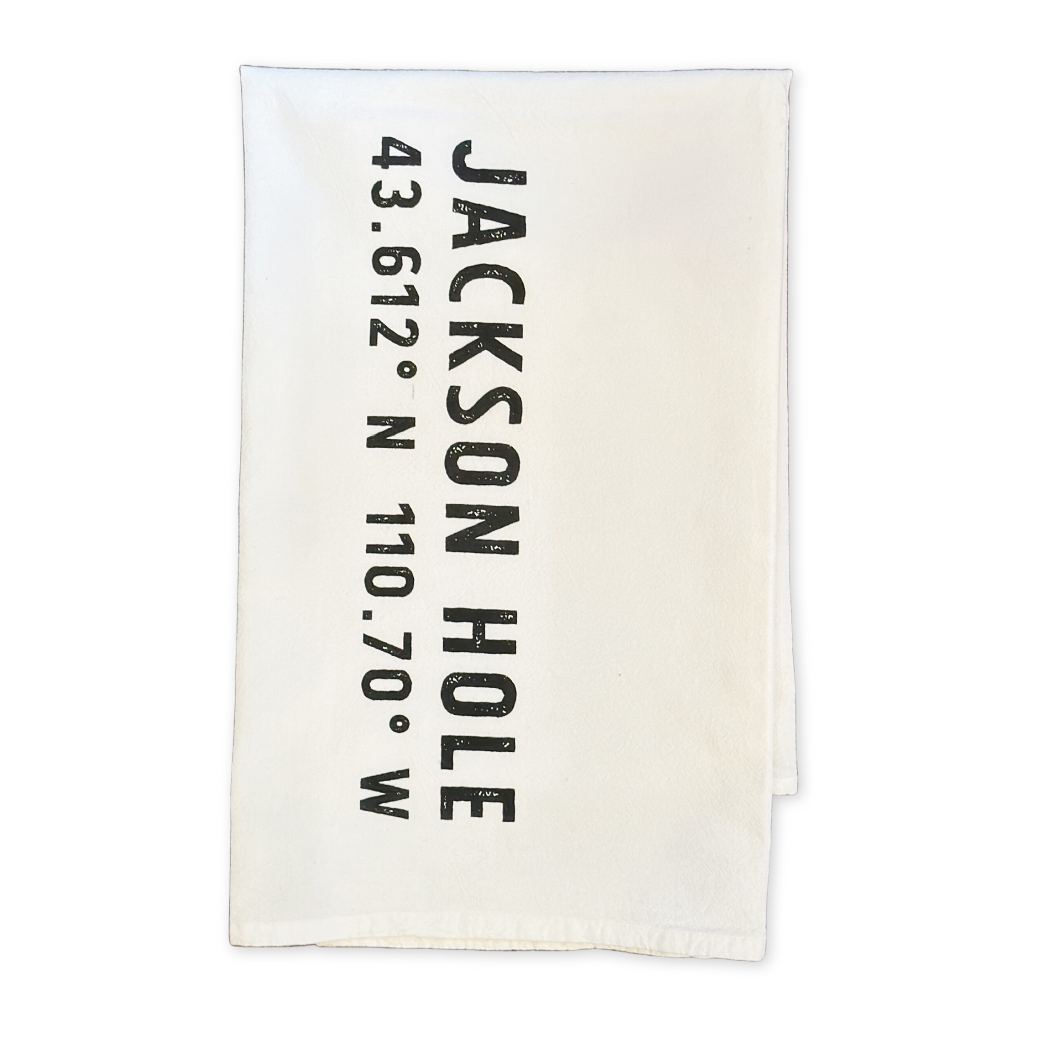 flour sack cotton tea towel featuring the latitude and longitude coordinates of jackson hole