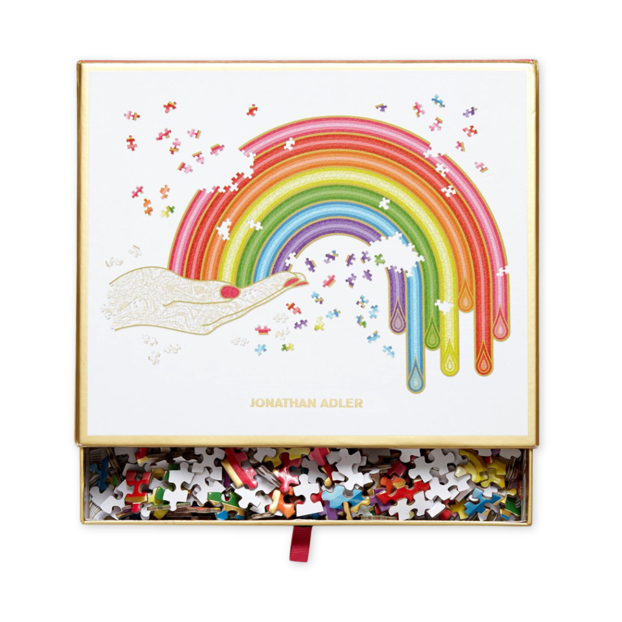 seven hundred fifty piece puzzle by artist johnathan adler in the shape of a hand holding a rainbow